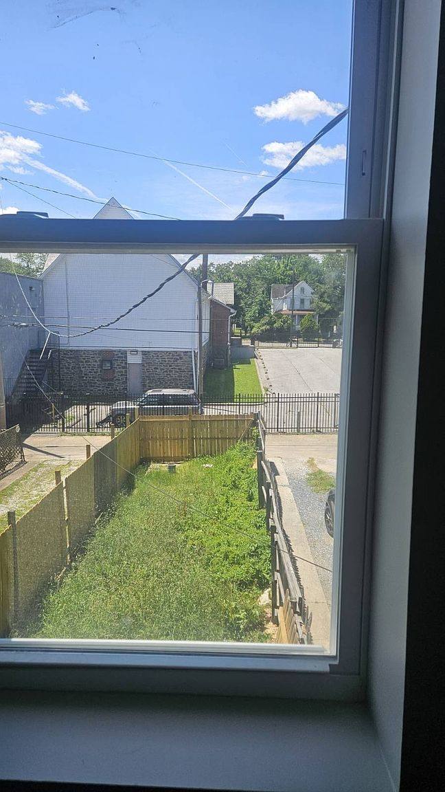 View from an upstairs window over the fenced back yard