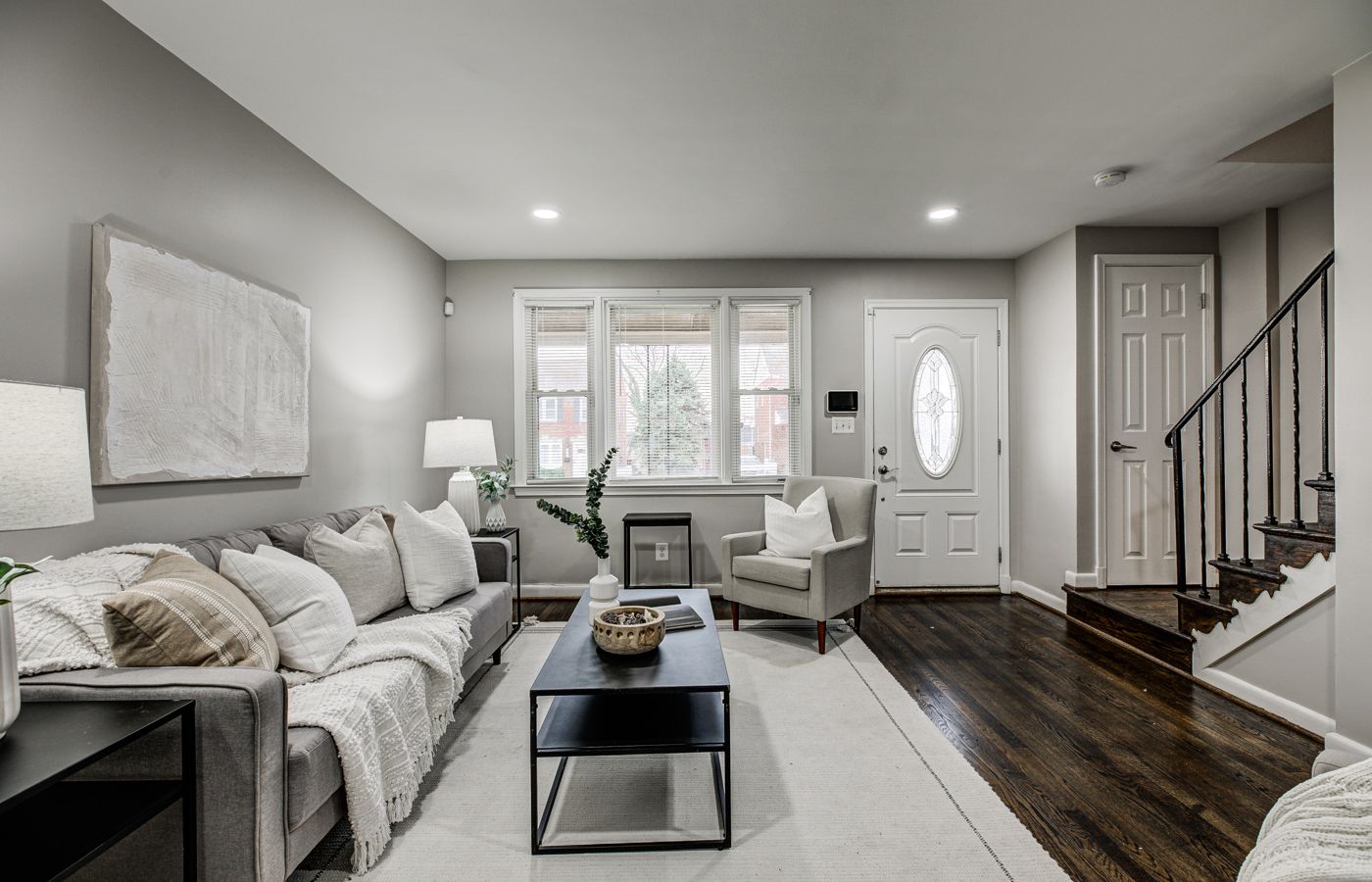 Staged living room in a Maryland rowhome we listed